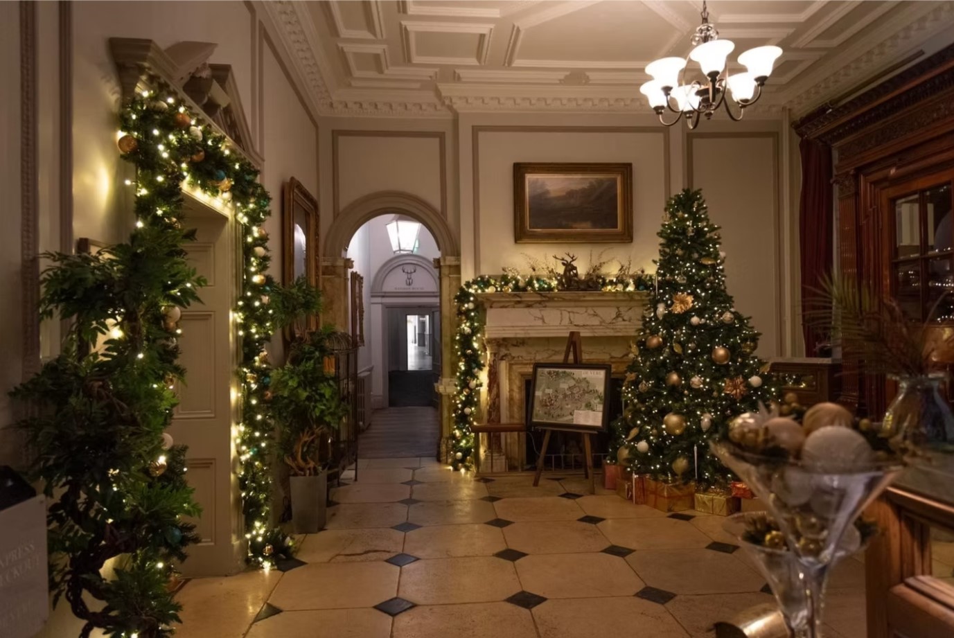 Christmas tree and lights in hallway at De Vere
